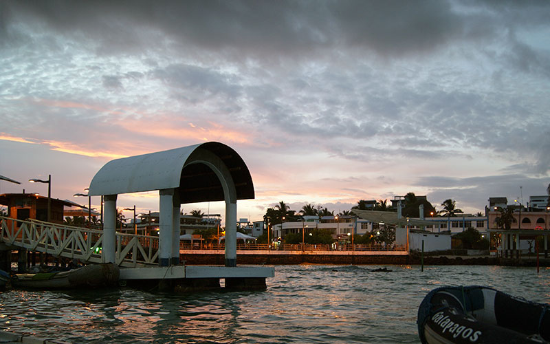 puerto ayora pier sunset galapagos ecuador